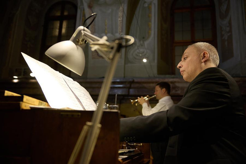 Two trumpet players performing a duet during an Advent concert at St. Anne’s Church.