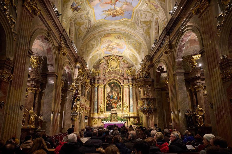 Trumpet and organ musicians performing near the altar of St. Anne's Church during Advent.